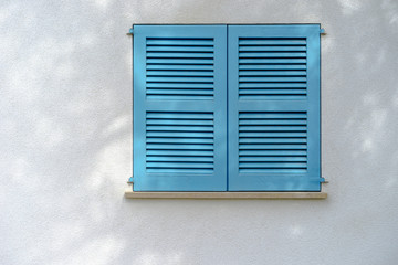 white wall with blue window stutter