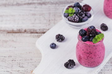 Fototapeta na wymiar Berry smoothie, healthy detox yogurt drink, diet or vegan food concept