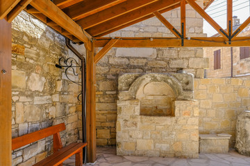 Fototapeta na wymiar Water fountain inside the monastery at Omodos, Cyprus