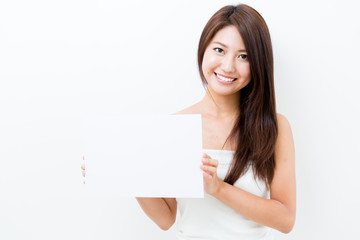 attractive asian woman holding blank whiteboard