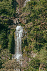  a privileged view of the Farofa waterfall amid the shrubs and rocks