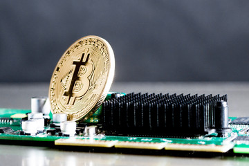 gold coin cryptocurrency bitcoin is on the computer Board