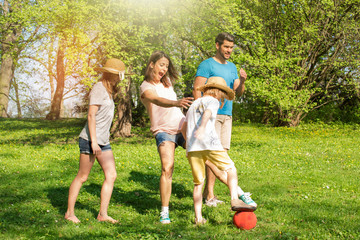 Fun in the Park family playing football