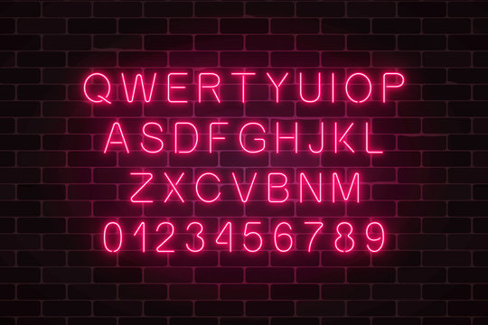 Glowing neon alphabet font on dark brick wall background. Vector neon style letters