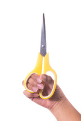 Female hand holding scissors on white background