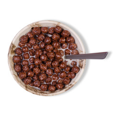 Dry breakfast with milk in plate with spoon