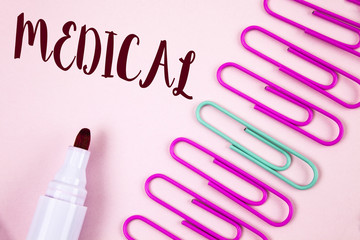 Writing note showing  Medical. Business photo showcasing Related to science of Medicine Treatment for illness or injuries written on Plain Pink background Marker and Paper Pins next to it.