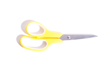 Yellow scissors isolated on a white background