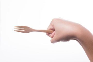 Men hand holding wooden fork on white background