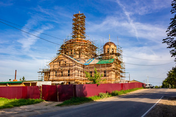 KOMLEVO, RUSSIA - JULY 2017: Construction of the Church of the Nativity of John the Baptist (Rozhdestva Ioanna Predtechi) in the village of Komlevo