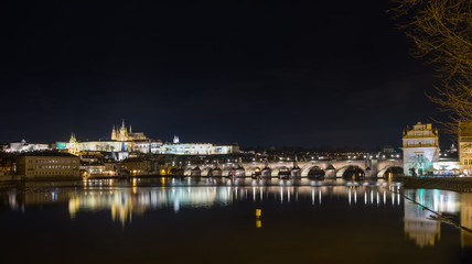 Fototapeta na wymiar Night view of the famous Charles Bridge with the Vltava river from the old district of the city of Prague. Czech Republic