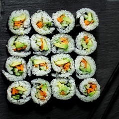 Homemade vegetarian Sushi roll with avocado,carrot and cucumber