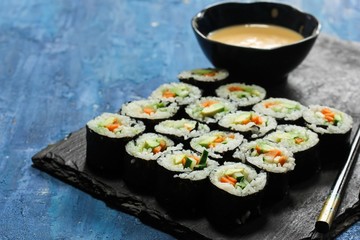 Homemade vegetarian Sushi roll with avocado,carrot and cucumber