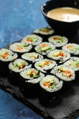 Homemade vegetarian Sushi roll with avocado,carrot and cucumber