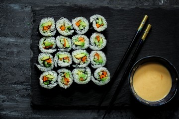 Homemade vegetarian Sushi roll with avocado,carrot and cucumber