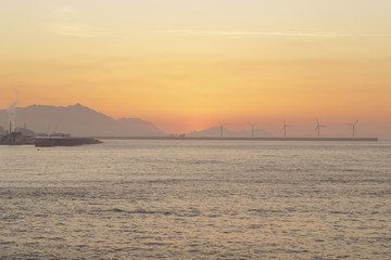 Serene seascape in Arrigunaga beach, Biscay, Basque Country, Spain. Long exposure on a misty sunset.