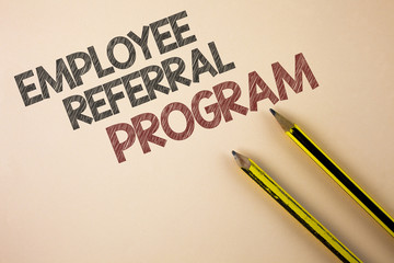 Writing note showing  Employee Referral Program. Business photo showcasing strategy work encourage employers through prizes written on Plain background Pencils next to it.