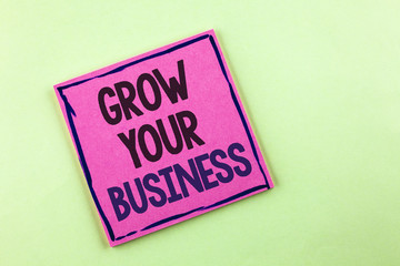 Text sign showing Grow Your Business. Conceptual photo improve your work enlarge company overcome competitors written on Pink Sticky Note Paper on the plain background.