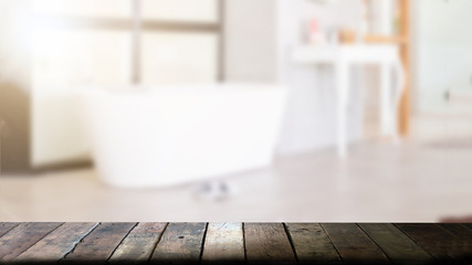 Wood top table with copy space on blurred bathroom background For product display montage.