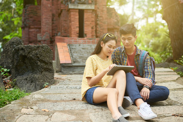 Travellers with tablet computer