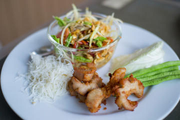 Papaya salad and pork fried