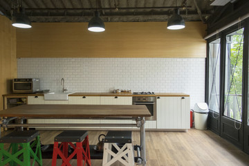 Corner of the white kitchen. The kitchen is decoration with white tile and wooden.