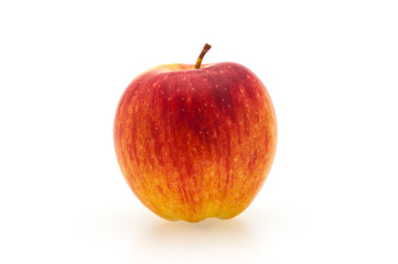 Single fresh red apple with shadow. Isolated on white background. Close-up.