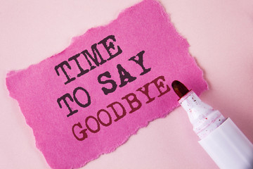 Word writing text Time To Say Goodbye. Business concept for Separation Moment Leaving Breakup Farewell Wishes Ending written on Tear Pink Sticky note paper on Pink background Marker next to it.