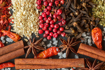 Aromatic Indian spices on a gray slate  background