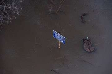 Sign flooded during the flooding of the river in the spring