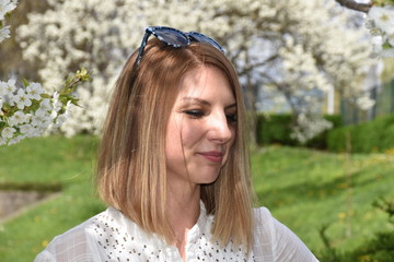 Young woman posing with cherry tree