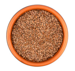 Flax seeds in ceramic bowl isolated on white background.