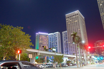 Fototapeta na wymiar Traffic along Downtown Miami streets at night