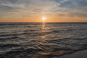 Naklejka premium Sunset in Baltic sea at Latvia coast.