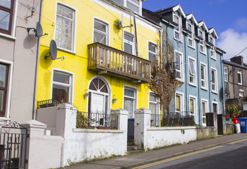 Fototapeta na wymiar A row of colourful traditional Victorian terrace houses in the cathedral area of the town of Cobh County Cork Ireland
