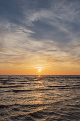 Naklejka na ściany i meble Sunset in Baltic sea at Latvia coast.