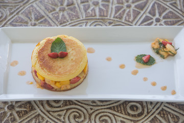 Delicious pancakes close up with fresh fruits healthy breakfast concept