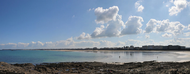 Ultra Wide View of the beach of Saint Malo City during low tide with Blue Sky