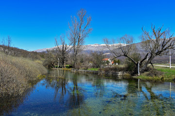 Concept of cultural and ecological tourism/Quiet lake in early spring morning 