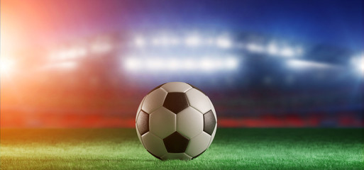 Fototapeta na wymiar Football ball on the field of a world cup stadium - 3d rendering