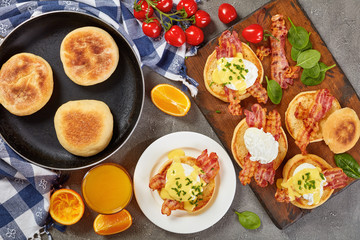 Eggs Benedict on plate and on board