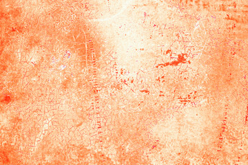 Textured metal surface carelessly colored orange paint