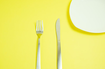 a knife and a fork.  ナイフとフォーク　黄色背景