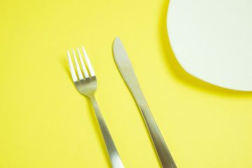 a knife and a fork.  ナイフとフォーク　黄色背景