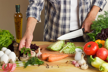 Woman cooks at the kitchen
