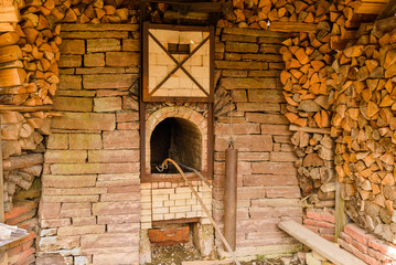 Traditional wood fired lime kiln for production of slaked lime. Working replica outside Borgholm castle ruin on Oland, Sweden.