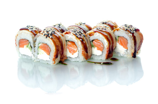 On white isolated background with reflection, sushi rolls with eel and uramaki salmon Emperor