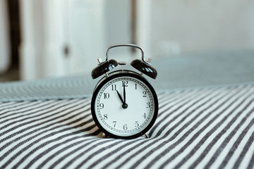 Vintage background with retro alarm clock 