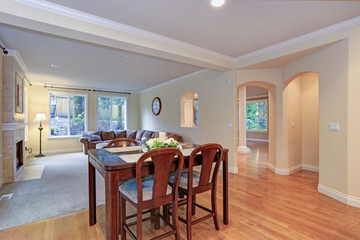 Spacious light home interior with dining area.