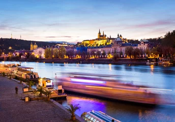 Foto auf Acrylglas Boat on the Vltava at night with St. Vitus Cathedral in the background, Prague © pixelklex